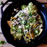 Chilaquiles Verdes in a cast iron skillet