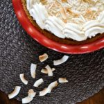 Coconut Cream Pie on a placemat then on a coffee table