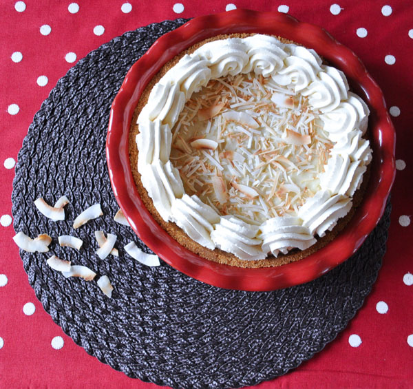 Coconut Cream Pie on a placemat then on a red with white polka dot table runner
