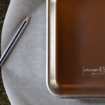 A pan with a sketch of how to parchment a baking pan