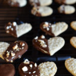 Embossed Chocolate Dipped Sugar Cookies on a wire rack