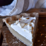 A slice of Butterscotch Pie with Spiced Rum Whipped Cream