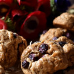 Blueberry Coconut Clove Scones with blueberries and red and blue flowers