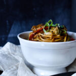 Easy Udon Noodle Vegetable Stir Fry on a napkin with a blue background