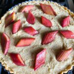 A close up of an Bakewell Tart | Roasted Rhubarb.