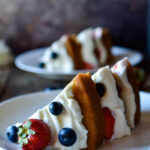 Two slices of Berry Almond Cake plated