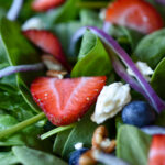 A plate of Berry Balsamic Spinach Salad