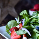 A plate of Berry Balsamic Spinach Salad