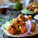 Chipotle Roasted Cauliflower Tacos on a rack with another taco in the background.