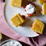 An overview of a platter of A Cornbread Strawberry Shortcakes.