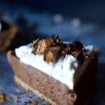 A close up of a slice of Frozen Chocolate Peanut Butter Pie