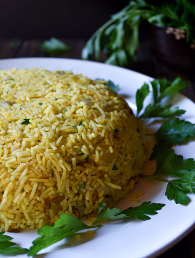 Saffron Rice with Cabbage and Golden Raisins made into a rice dome.